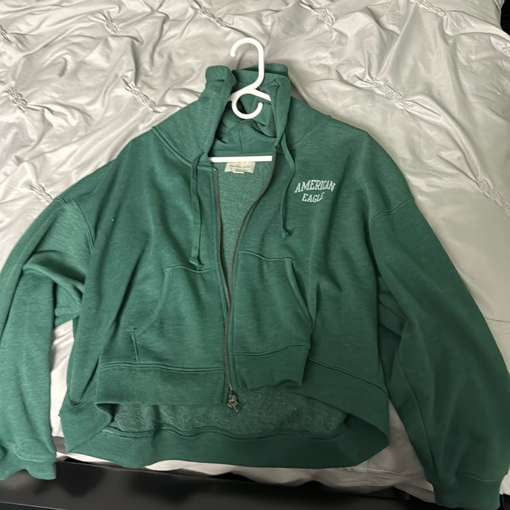 A Women’s American Eagle zip up hoodie in the size large